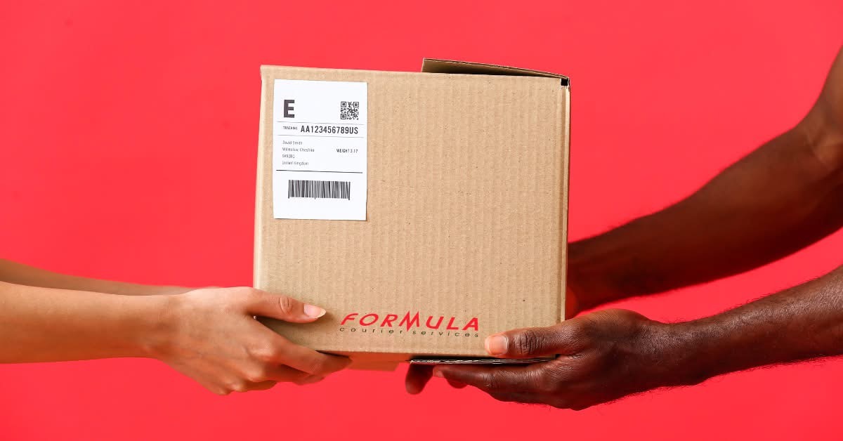 A Formula Courier Services parcel being handed off to a customer